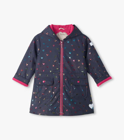 Front view of navy hooded rain coat with rainbow foil cherry print, pink lining, zipper, and two flap pockets
