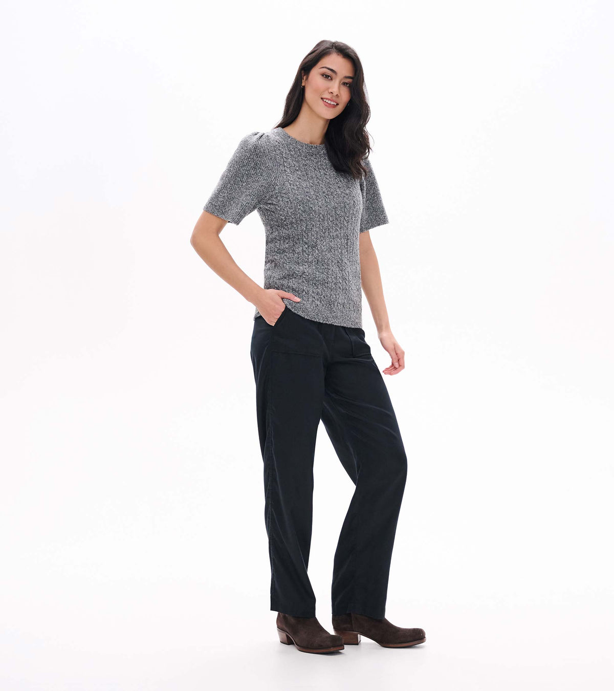 Three-quarter view of grey boucle sweater with short puff sleeves and crew neckline