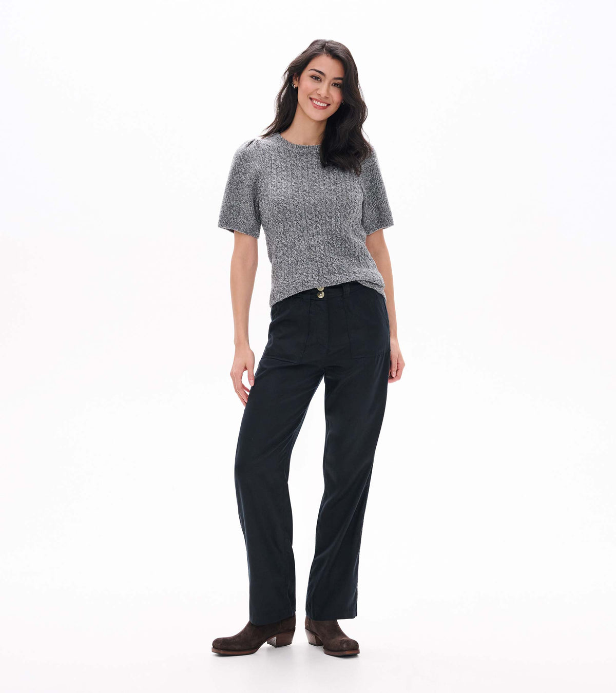 Front view of grey boucle sweater tucked at the waist with short puff sleeves