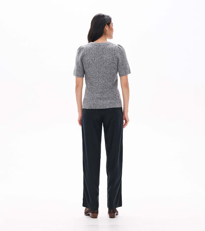 Back view of grey boucle sweater with short puff sleeves and a fitted shape
