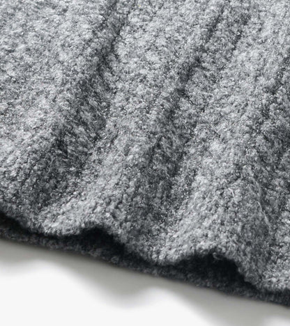 Close-up of the Emerson Sweater in grey boucle with a soft, nubby textured knit