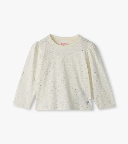 Front view of cream infant tee with silver flecks, puff shoulders, long sleeves, and small heart detail