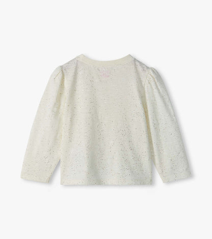 Back view of cream infant tee with silver flecks, puff shoulders, and long sleeves