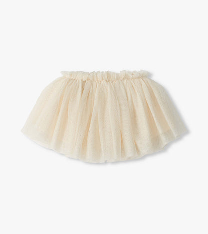 Close-up of cream puffy tutu skirt with glittery dotted tulle and ruffled elastic waistband