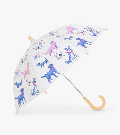 Open clear kids umbrella with colorful dog print, pink tips, and curved wooden-look handle