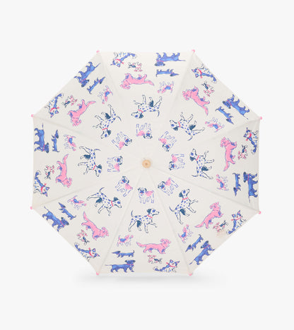 Top view of clear umbrella canopy with pink, blue, and spotted dog illustrations