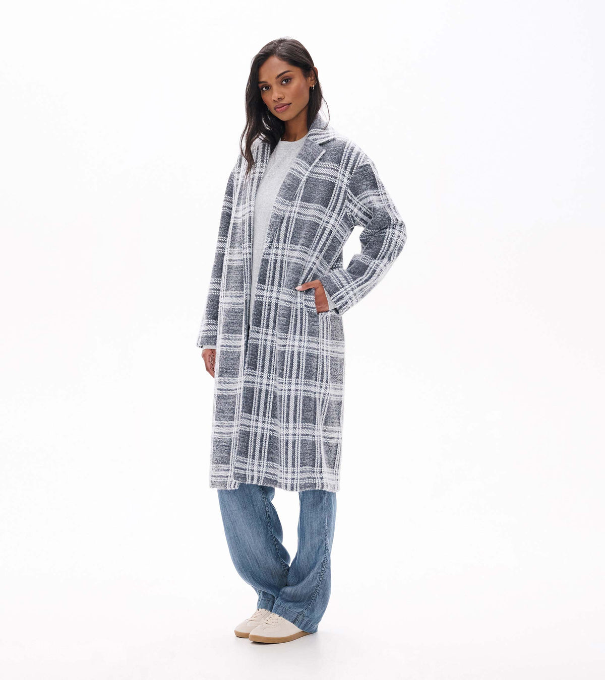 Front view of Paxton Jacket in charcoal plaid styled with jeans, showing side pockets
