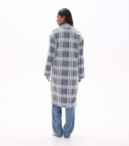 Back view of long charcoal plaid jacket with white grid pattern and straight hem
