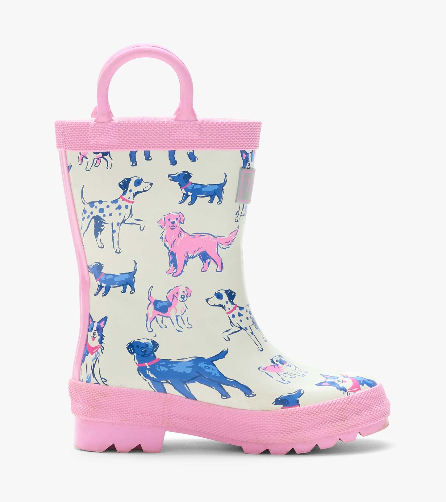 Side view of a cream rain boot with pink handles and trim, featuring blue and pink dog illustrations
