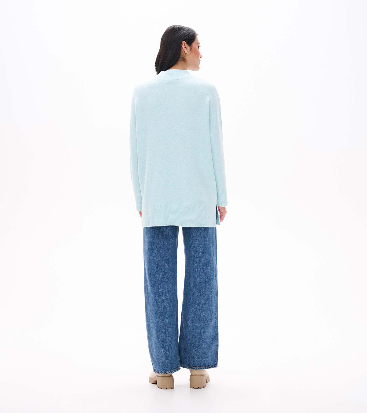 Back view of teal tunic sweater with mock neck, long sleeves, and ribbed hem