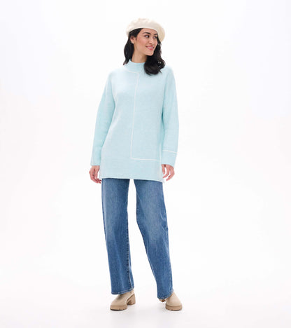 Front angled view of teal tunic sweater with mock neck and contrast line detail