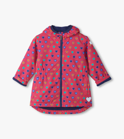 Front view of pink Heart Bunches field jacket with blue zipper, hood, and multicolor heart print