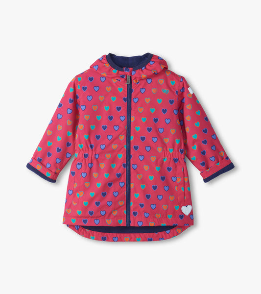 Front view of pink Heart Bunches field jacket with blue zipper, hood, and multicolor heart print