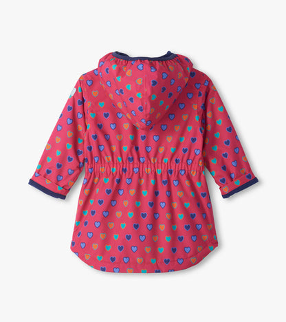 Back view of pink Heart Bunches field jacket with hood, gathered waist, and multicolor heart print