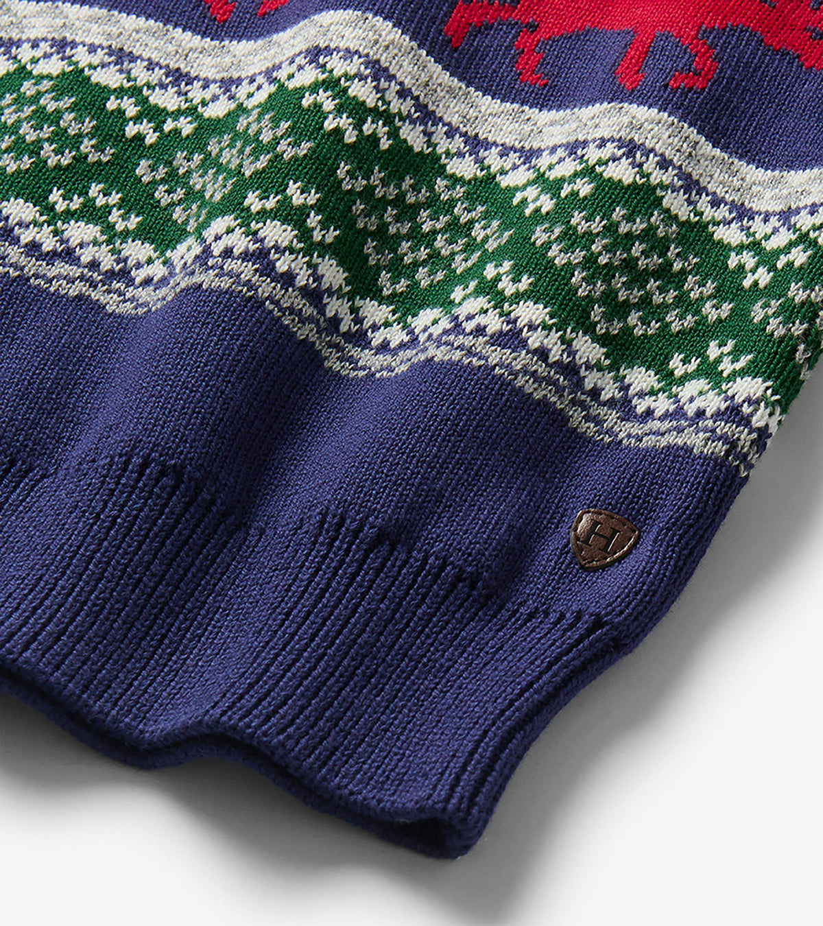 Close-up of navy hem and green Fair Isle knit on boys holiday sweater with small shield logo patch