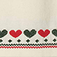 View Girls Holiday Hearts Swing Sweater Dress cream knit swatch with alternating red and green hearts and a red-and-green geometric border