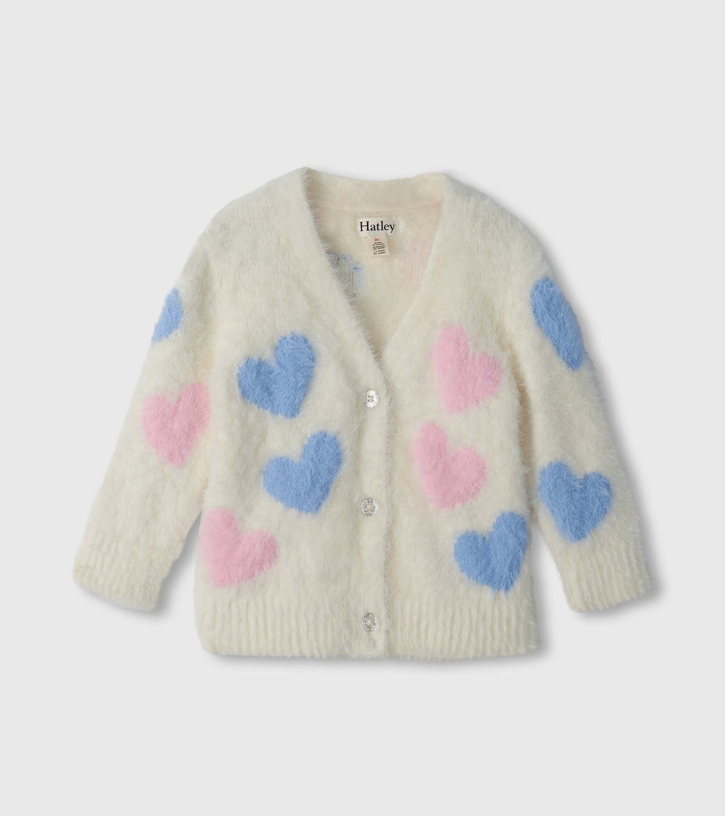Cream fuzzy cardigan with pink and blue heart pattern, V-neck, long sleeves, and front buttons