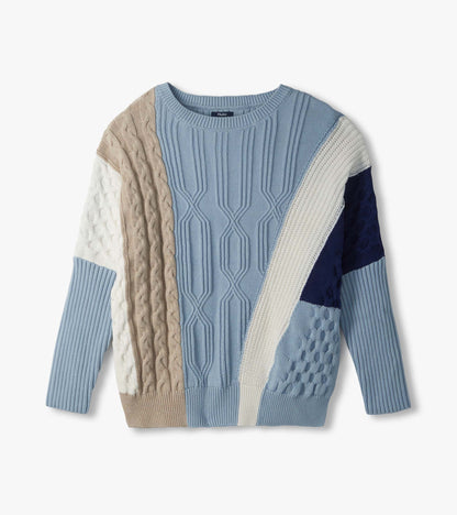Flat lay front of blue mixed-pattern sweater with ribbed, cable and textured color-block panels