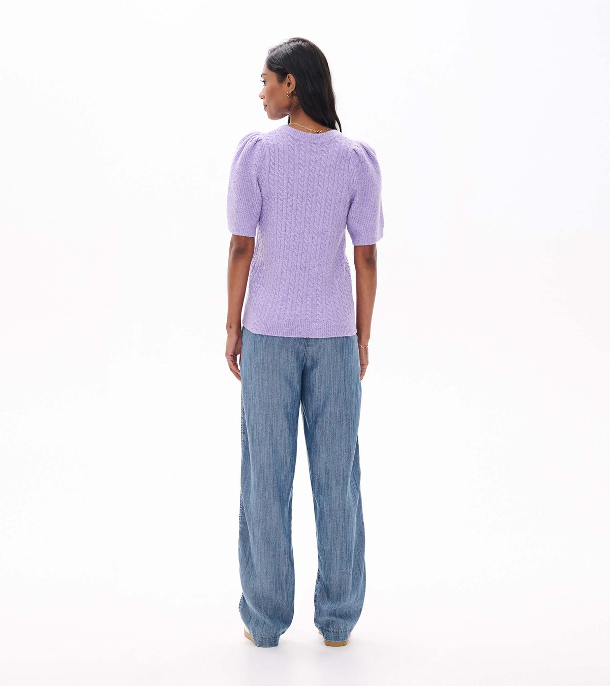Back view of lilac cable knit sweater with short puff sleeves