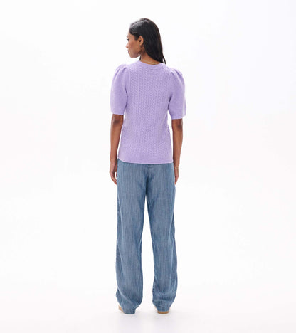 Back view of lilac cable knit sweater with short puff sleeves