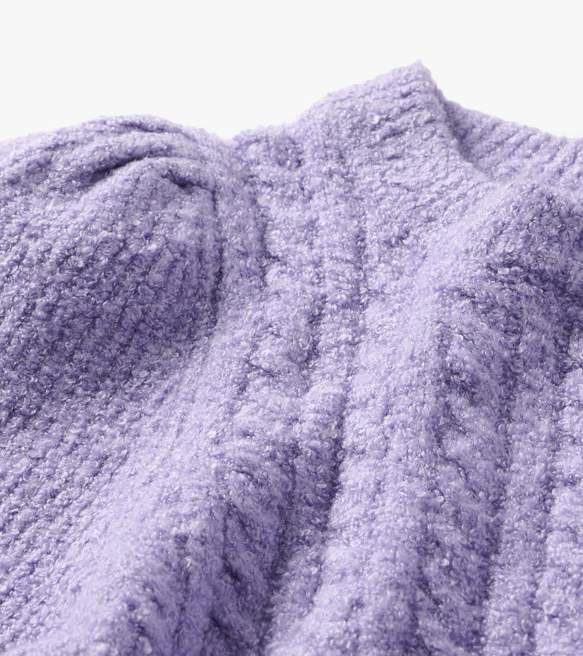 Close-up of the Emerson sweater in lilac with a textured boucle surface and folded collar detail