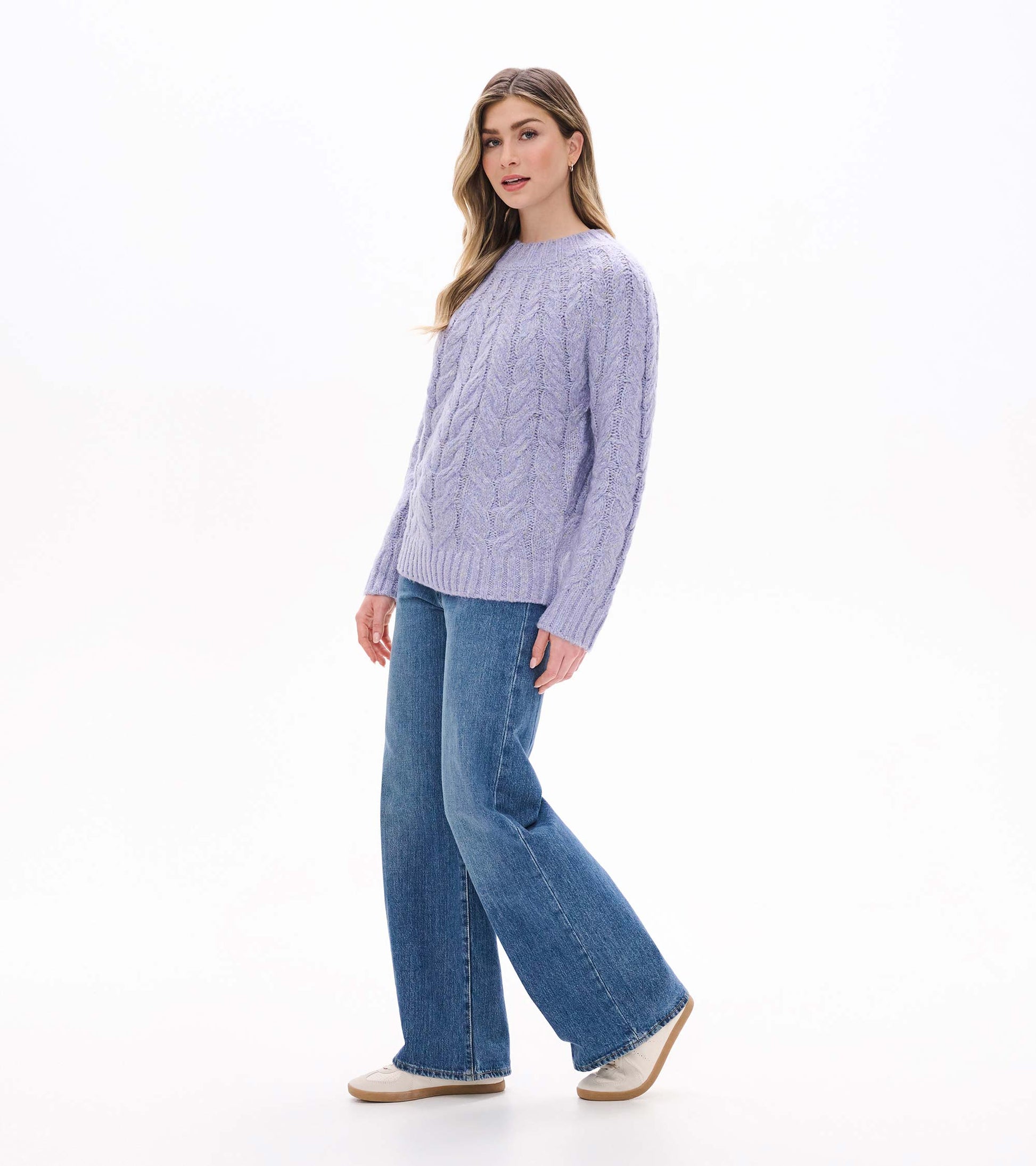 Side front view of Dylan Sweater in speckle lilac showing cable knit texture and relaxed fit