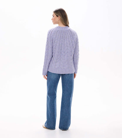 Back view of Dylan Sweater in speckle lilac with cable knit pattern and ribbed hem