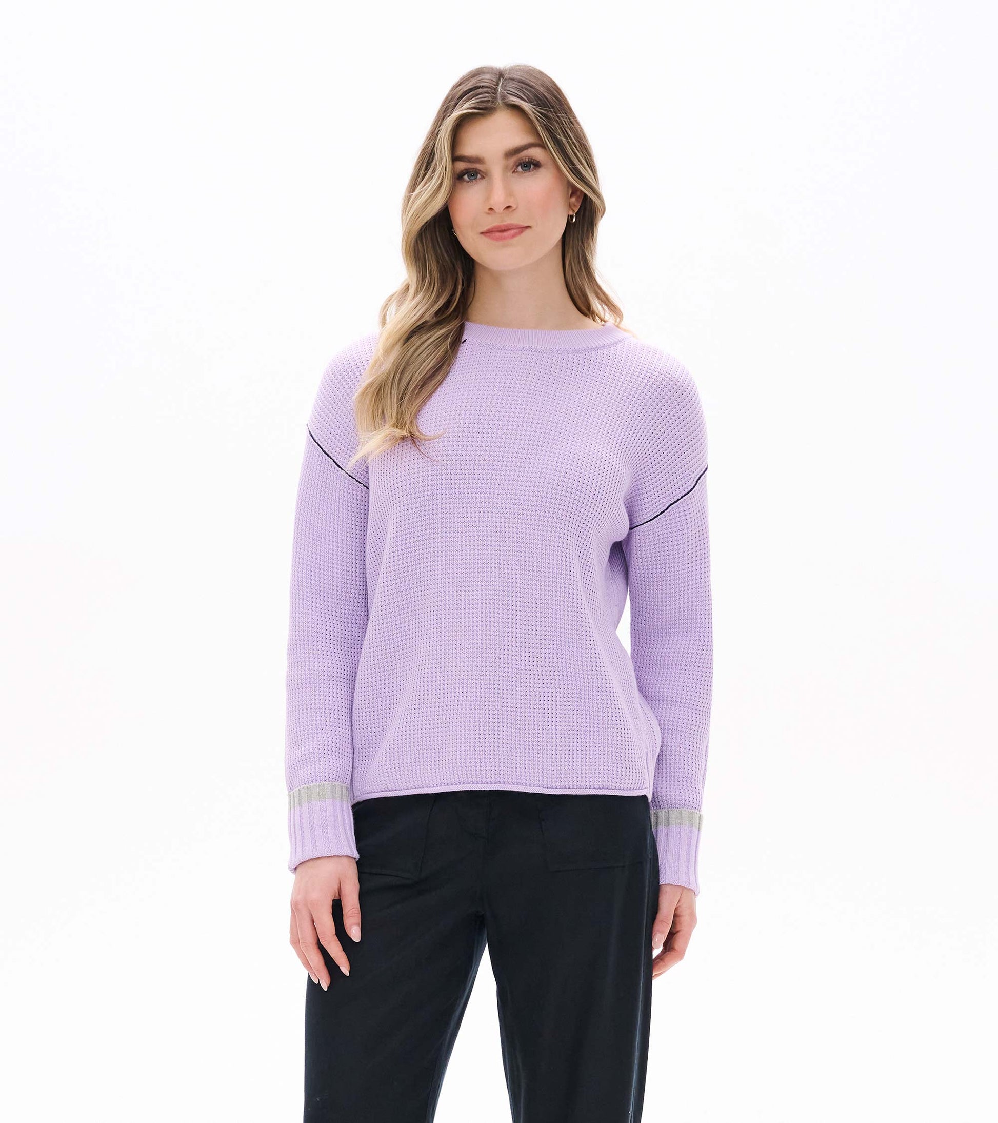 Front view of lilac waffle knit sweater with drop shoulders, crew neck, and contrast cuff bands