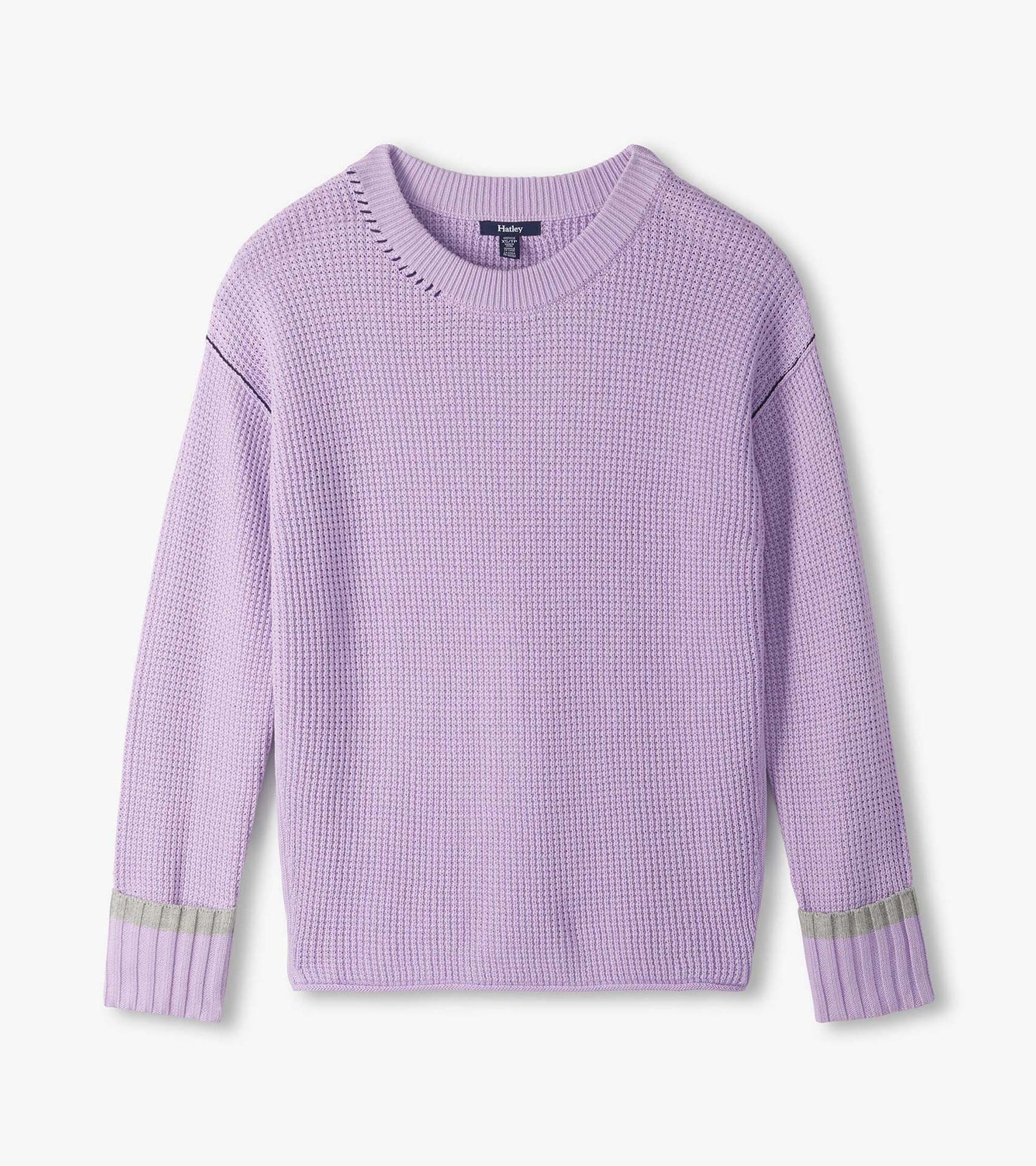 Flat lay of lilac waffle knit sweater with crew neck, drop shoulders, and contrast bands at the cuffs