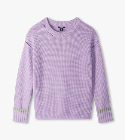 Flat lay of lilac waffle knit sweater with crew neck, drop shoulders, and contrast bands at the cuffs