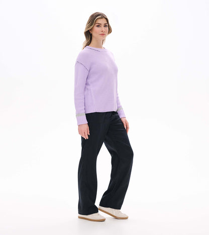 Side view of lilac waffle knit sweater with crew neck, drop shoulders, and contrast cuff bands