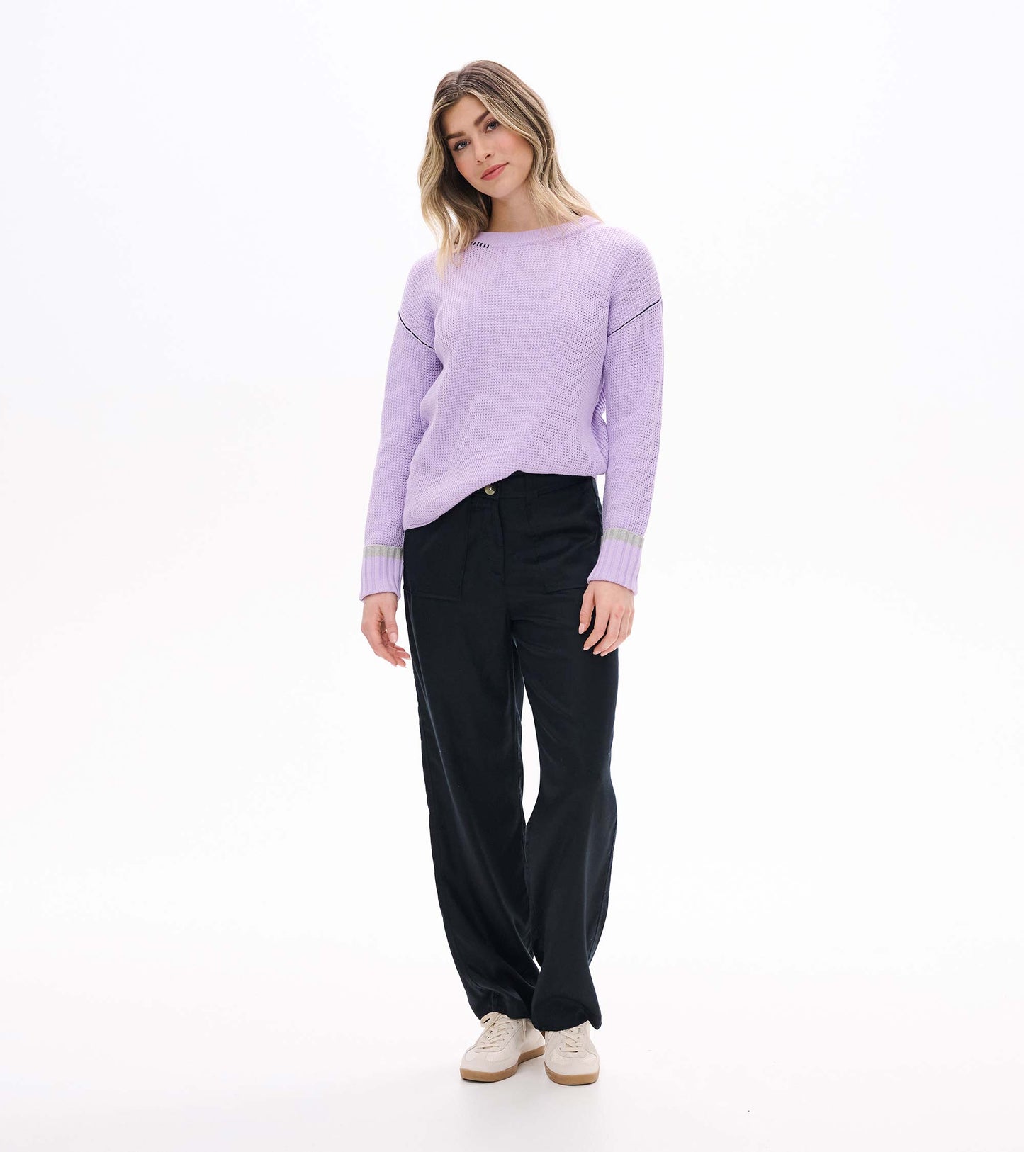 Front angled view of lilac waffle knit sweater with crew neck, drop shoulders, and contrast cuff bands