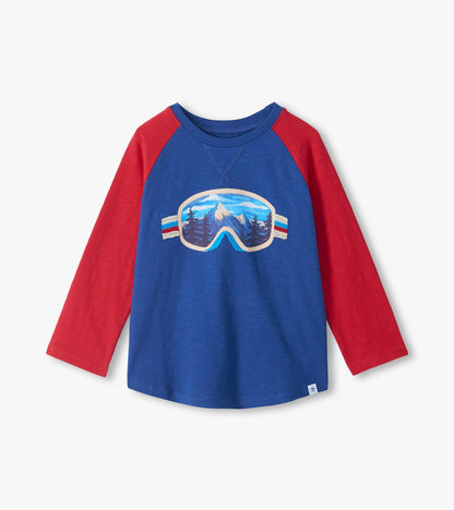 Front view of boys blue raglan T-shirt with red sleeves and ski goggles mountain graphic
