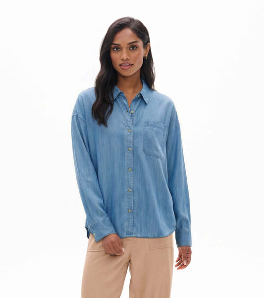 Front view of light blue wash relaxed button-down shirt with collar, button front, and chest pocket