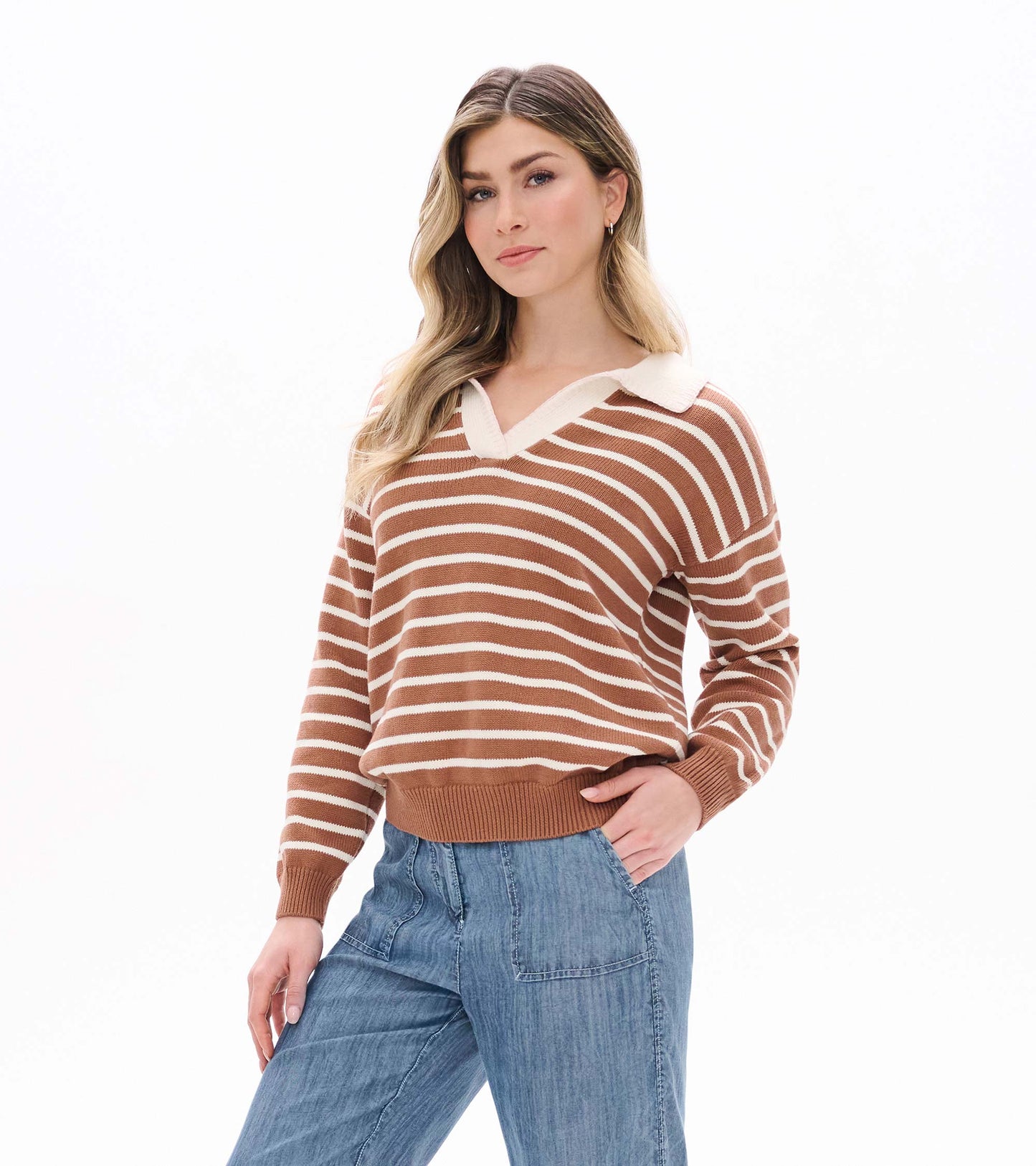 Model wearing camel and cream striped Johnny collar sweater with long sleeves and ribbed hem