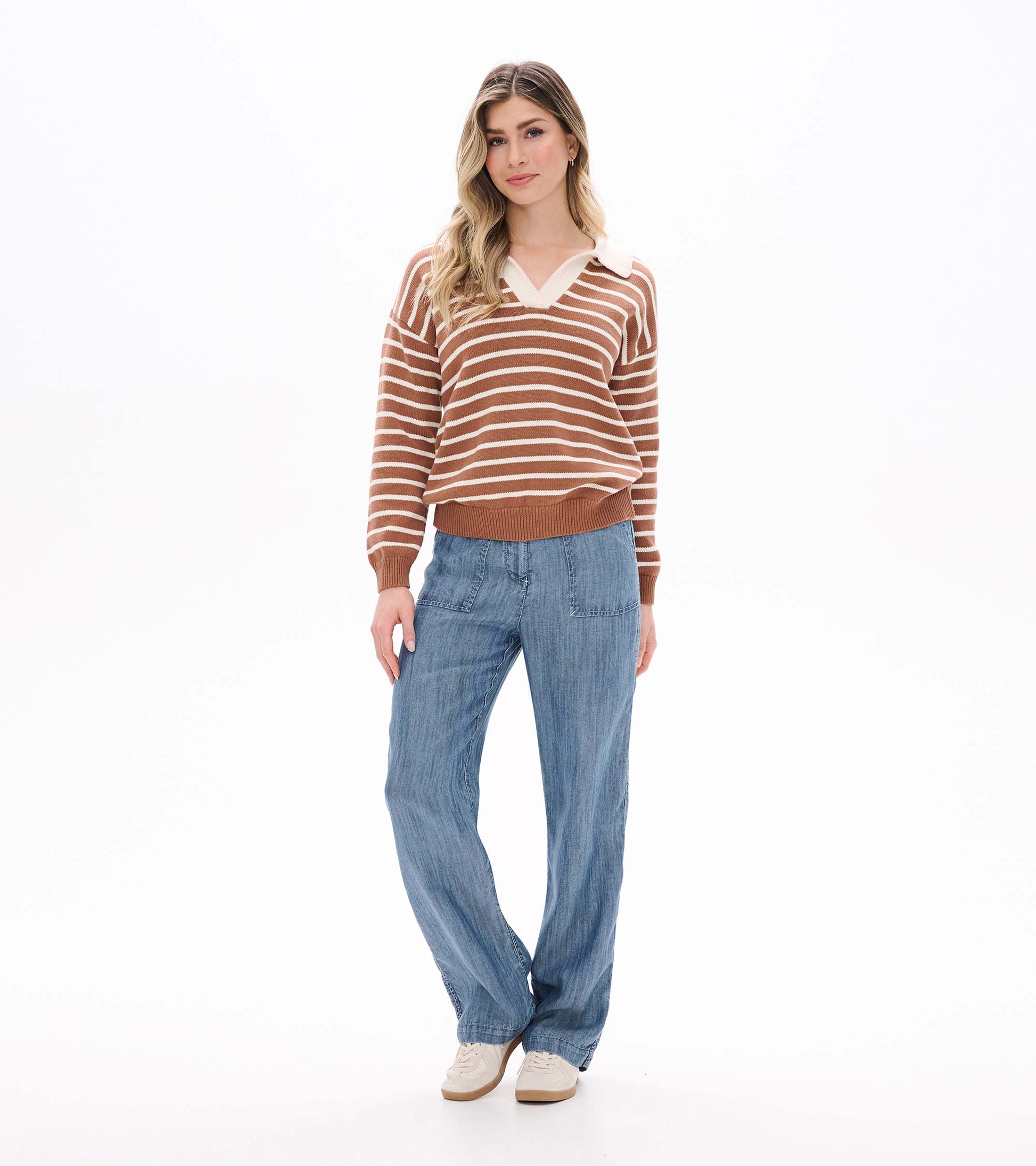 Full front view of camel and cream striped Johnny collar sweater on model