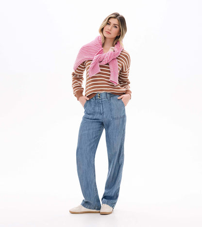 Camel and cream striped Johnny collar sweater on model styled with a pink sweater draped over shoulders