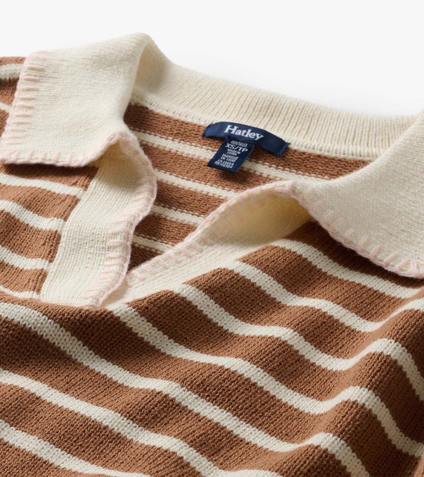 Close-up of camel and cream striped Johnny collar sweater with open cream collar and visible Hatley label