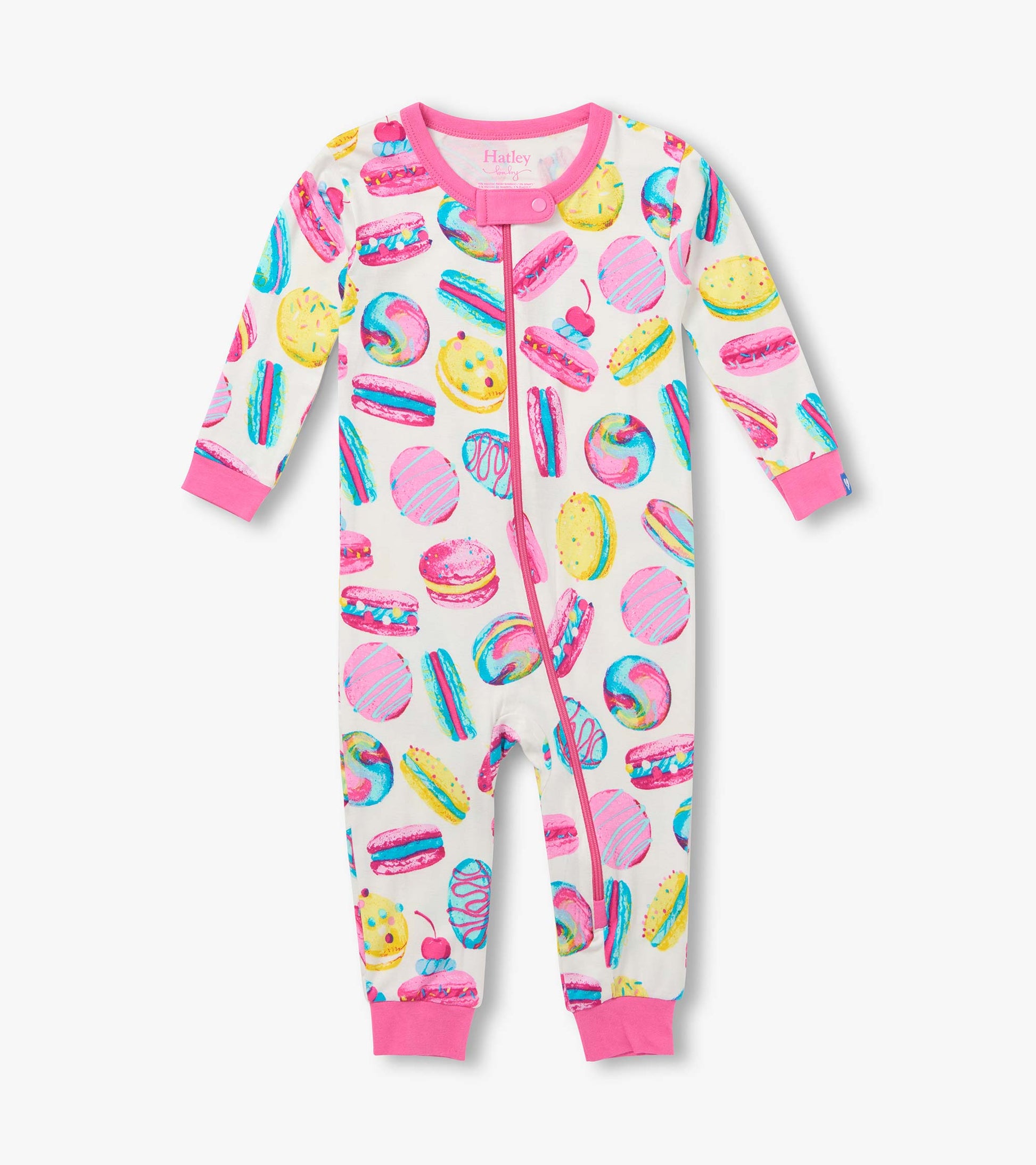 Front view of infant coverall with pink trim, zip front, and colorful macaron and pastry print