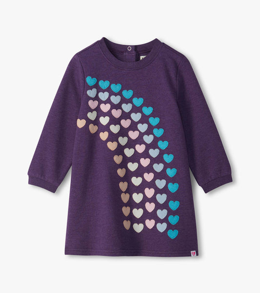 Infant purple long-sleeve dress with multicolor heart appliques in a cascading pattern on the front