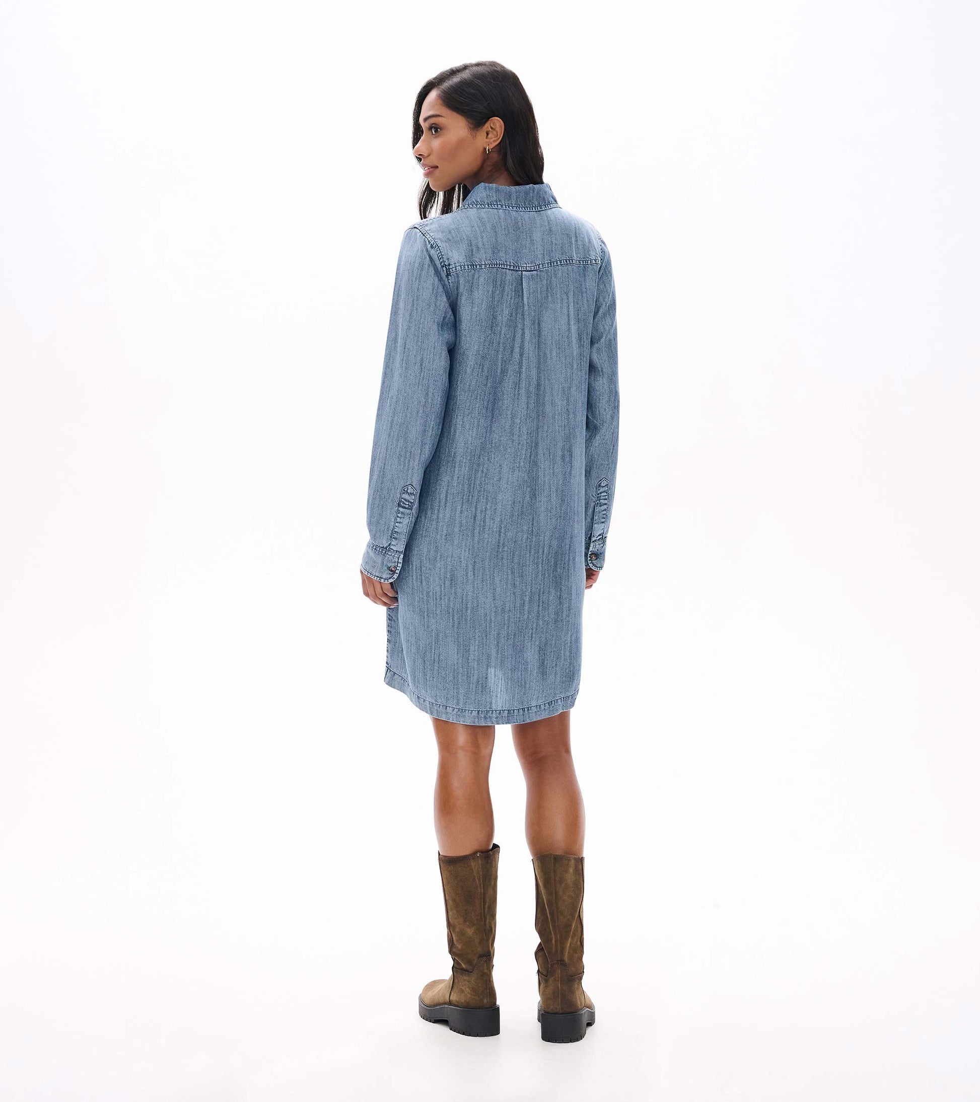 Back view of blue acid rinse popover dress with long sleeves and below-knee hem
