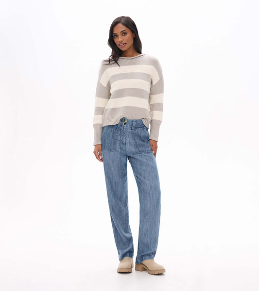 Front view of blue acid rinse wide leg pants with patch pockets and double-button waistband