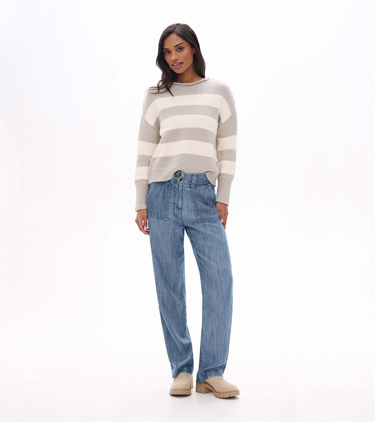 Front view of blue acid rinse wide leg pants with front patch pockets and button waistband
