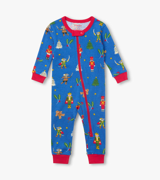 Front view of blue infant coverall with red trim, zipper, and nutcracker holiday print