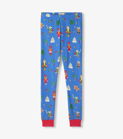Blue pajama pants with red ankle cuffs and nutcracker, mouse, tree and holly holiday print