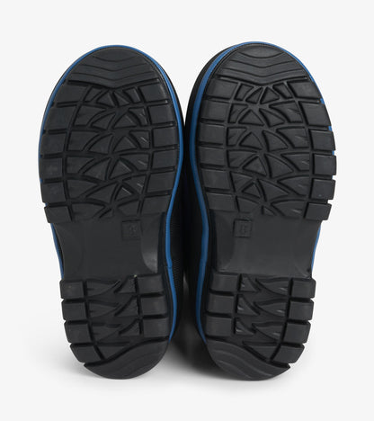 Bottom view of navy kids boots showing black lug outsole tread pattern