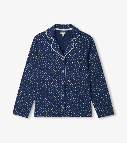 Blue polka dot pajama top with white piping, button front, long sleeves, and chest pocket