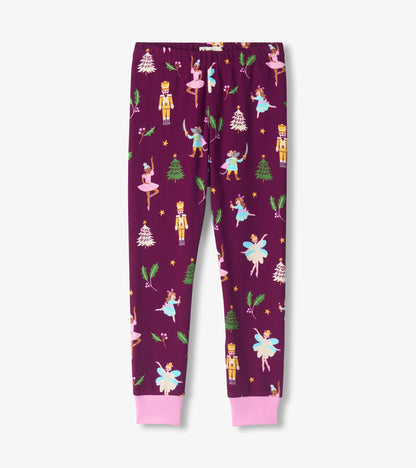 Girls purple pajama pants with pink ankle cuffs and Nutcracker print of ballerinas, toy soldiers and holly