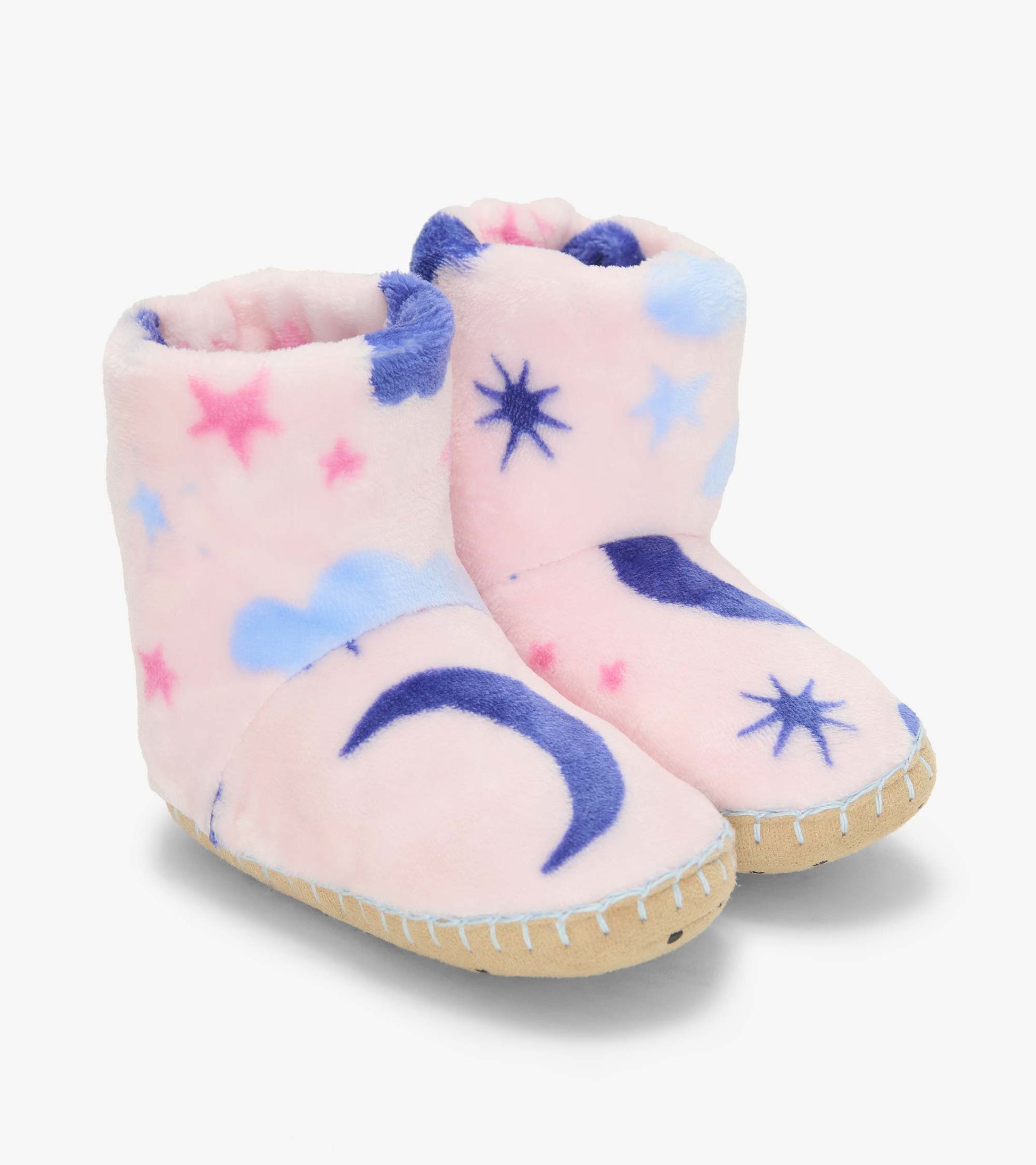 Pair of pink slipper boots with blue moons, stars and clouds, shown from the front