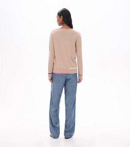 Back view of oatmeal crew neck sweater with long sleeves and pink, cream, tan, and gray trim accents